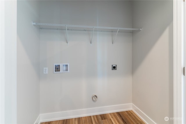 washroom with hardwood / wood-style floors, hookup for a gas dryer, hookup for an electric dryer, and hookup for a washing machine