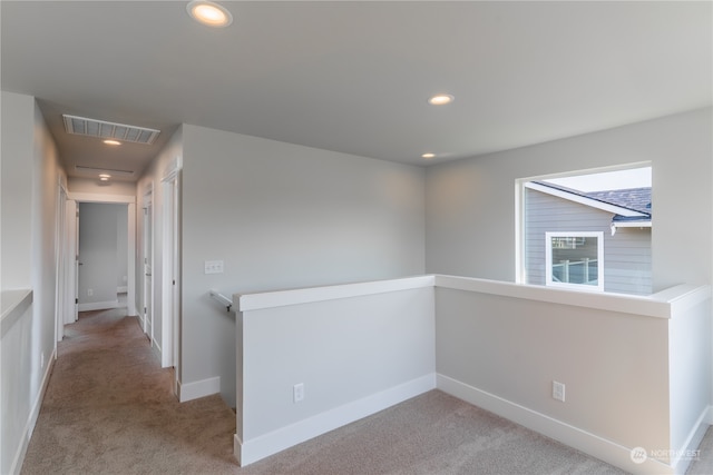 empty room with light colored carpet