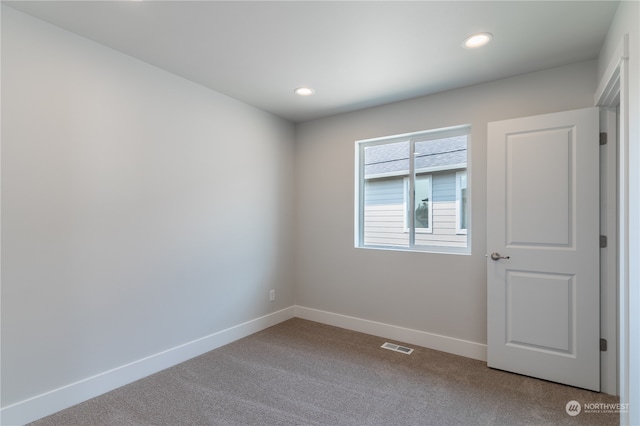 unfurnished room featuring carpet flooring