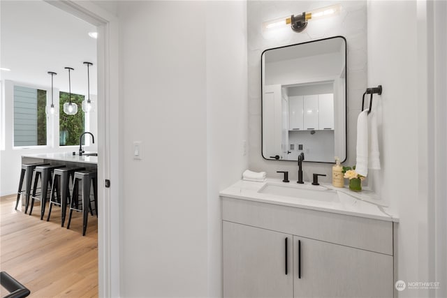 bathroom with vanity and hardwood / wood-style floors