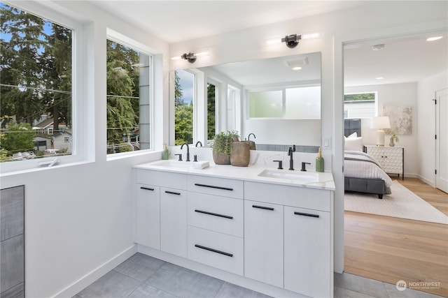 bathroom with vanity and wood-type flooring