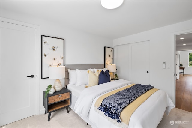 bedroom with a closet and light wood-type flooring