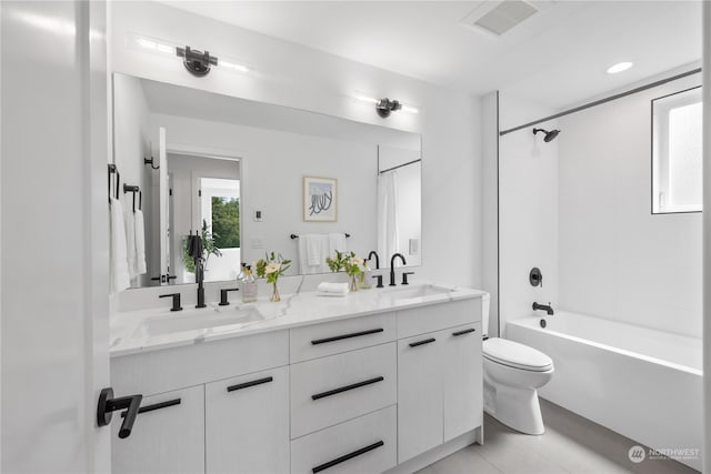 full bathroom featuring vanity, shower / bathtub combination with curtain, toilet, and tile patterned floors