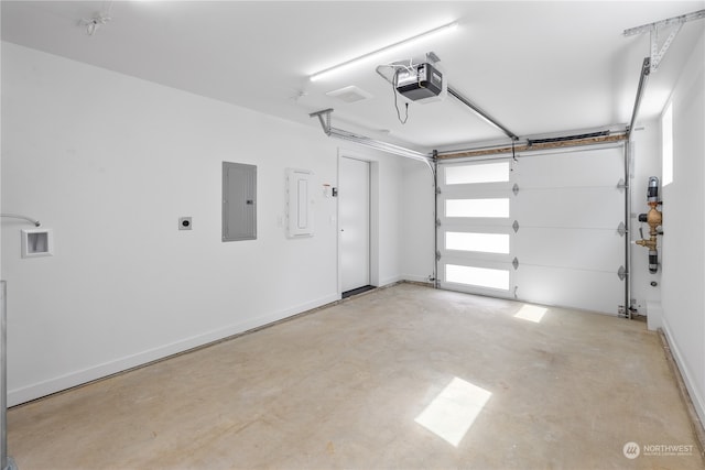 garage featuring electric panel and a garage door opener