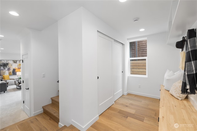 corridor featuring light hardwood / wood-style floors