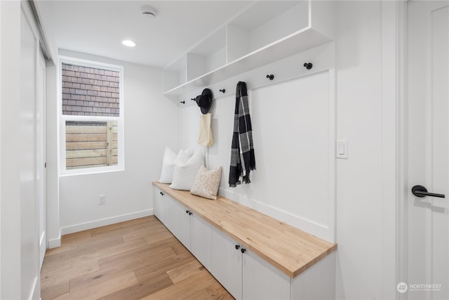 mudroom with light hardwood / wood-style flooring