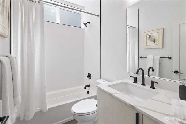 full bathroom featuring toilet, vanity, and shower / tub combo