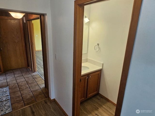 bathroom featuring vanity and hardwood / wood-style flooring