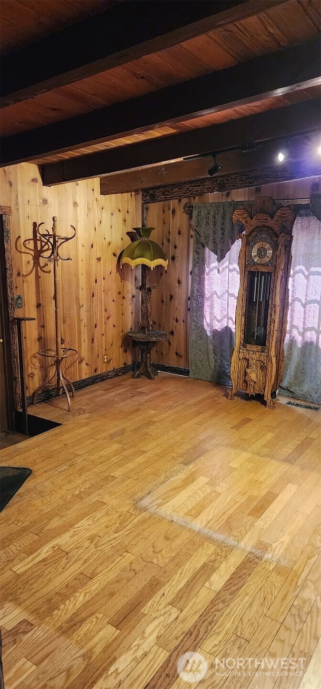 7118 96th St E, Puyallup, WA 98371 - unfurnished living room featuring beamed ceiling, wood-type flooring, and wooden walls
