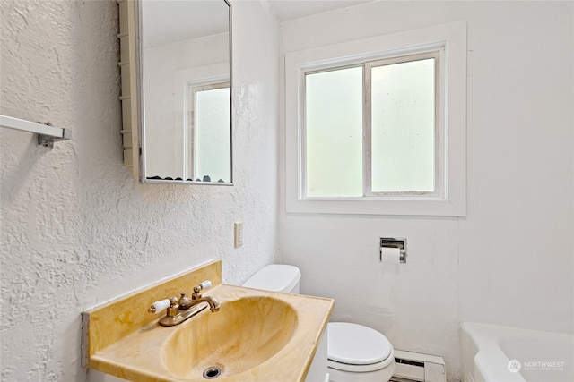 full bathroom with vanity, toilet, a healthy amount of sunlight, and a baseboard radiator