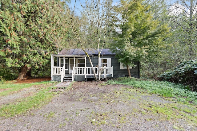 view of front of home featuring a sunroom