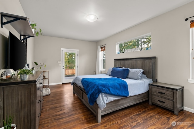 bedroom featuring access to exterior and dark hardwood / wood-style floors