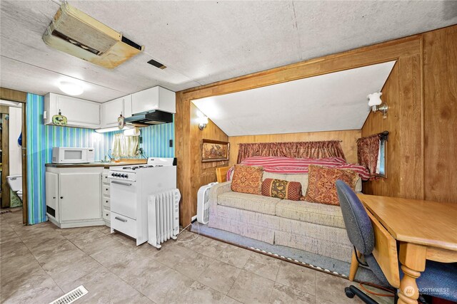 137 Mountain View Dr N, Ashford, WA 98304 - bedroom featuring wood walls, visible vents, and a textured ceiling
