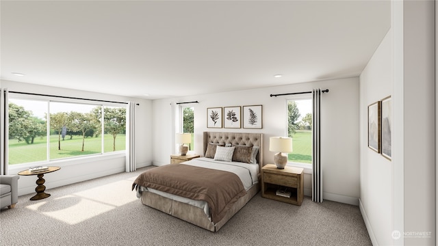 bedroom with multiple windows and carpet floors