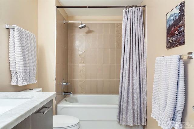 full bathroom featuring vanity, shower / tub combo, and toilet