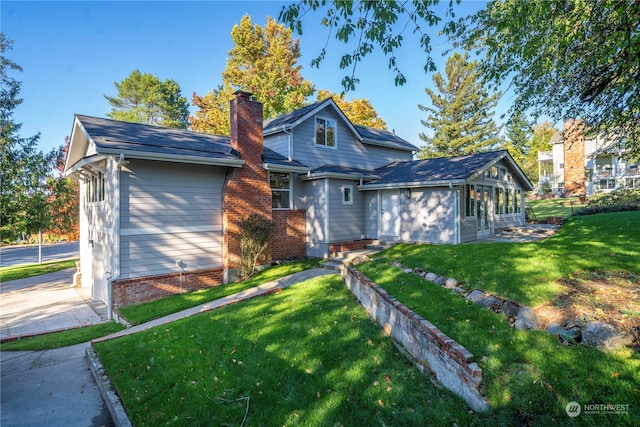 view of front facade with a front lawn and a garage