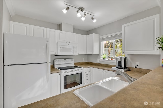 kitchen with sink, white cabinets, and white appliances