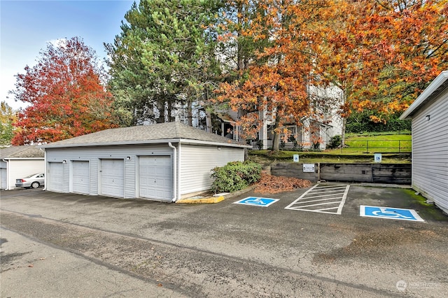 garage featuring a lawn