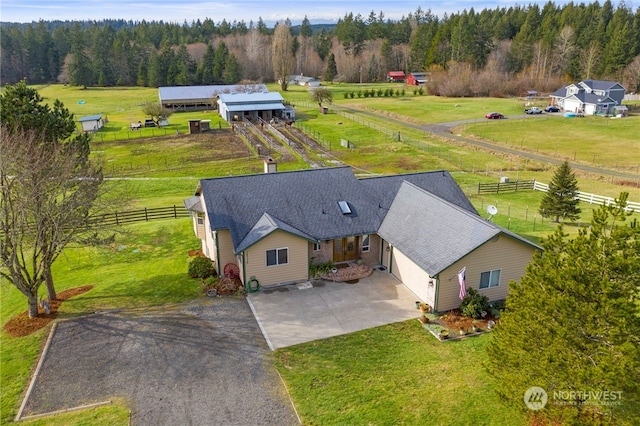 birds eye view of property with a rural view