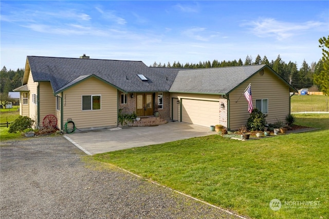 single story home featuring a front yard and a garage