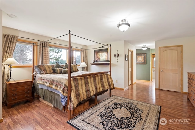 bedroom with hardwood / wood-style floors