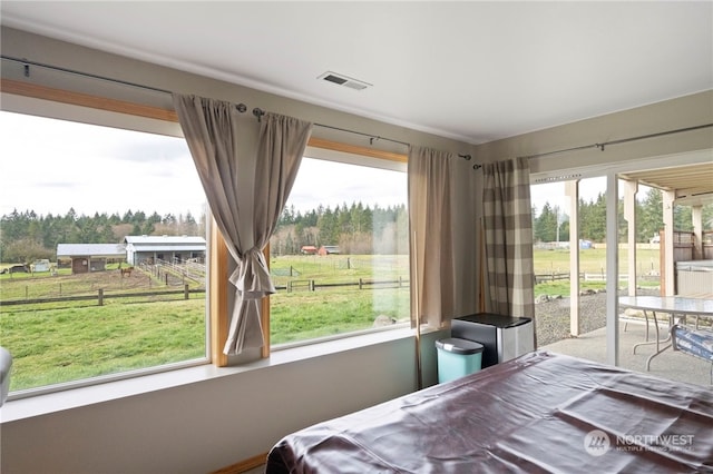 bedroom featuring multiple windows