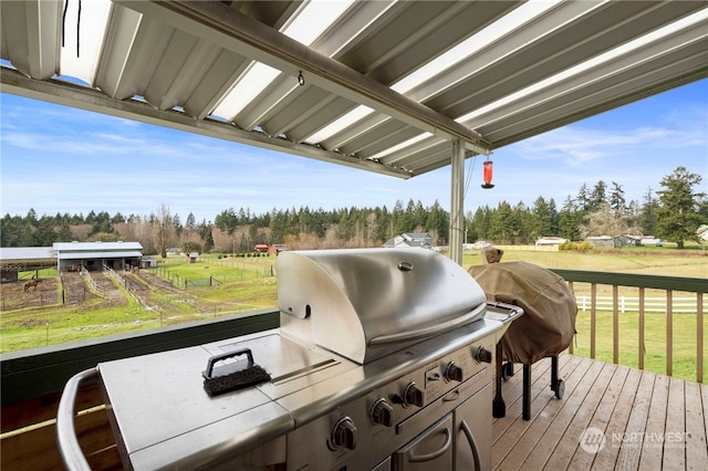 deck with a yard and grilling area