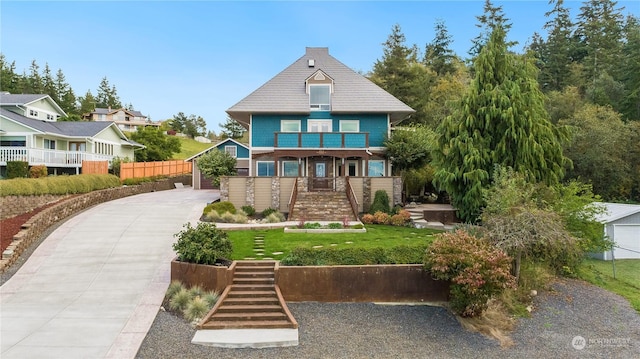 212 Grandview Ave, Camano Island, WA 98282 - back of property featuring stairs, driveway, fence, and a balcony