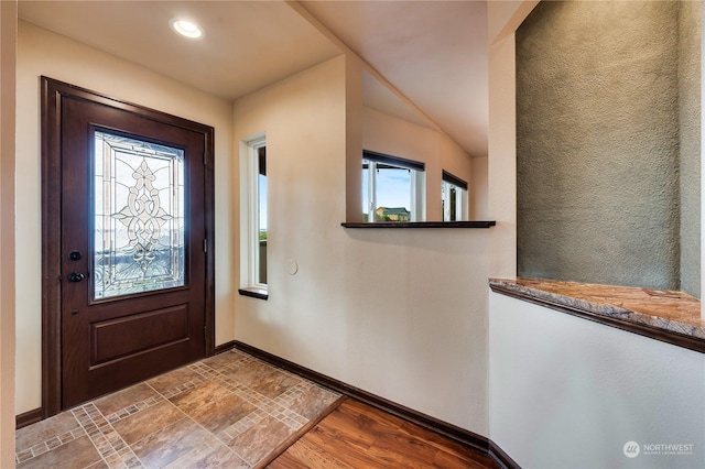 212 Grandview Ave, Camano Island, WA 98282 - foyer entrance with plenty of natural light, baseboards, and wood finished floors