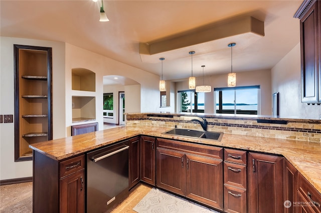 kitchen with stainless steel dishwasher, sink, kitchen peninsula, and pendant lighting