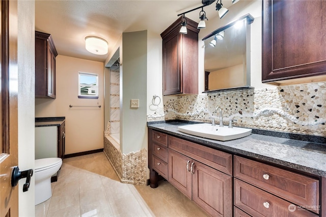 212 Grandview Ave, Camano Island, WA 98282 - bathroom with toilet, tiled shower / bath, tile patterned flooring, vanity, and decorative backsplash