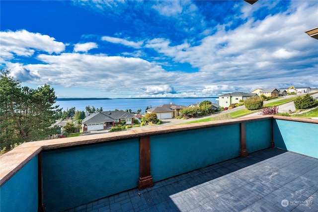 view of swimming pool with a water view