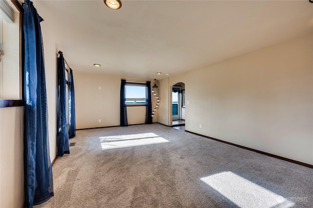 212 Grandview Ave, Camano Island, WA 98282 - carpeted spare room with arched walkways and baseboards