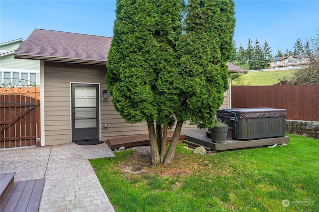212 Grandview Ave, Camano Island, WA 98282 - exterior space featuring a yard, a hot tub, fence, a wooden deck, and roof with shingles