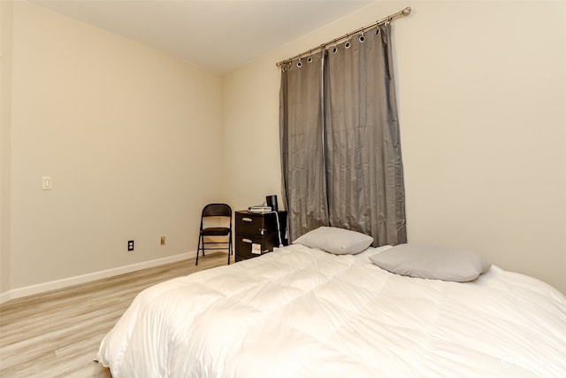 bedroom with light wood-type flooring