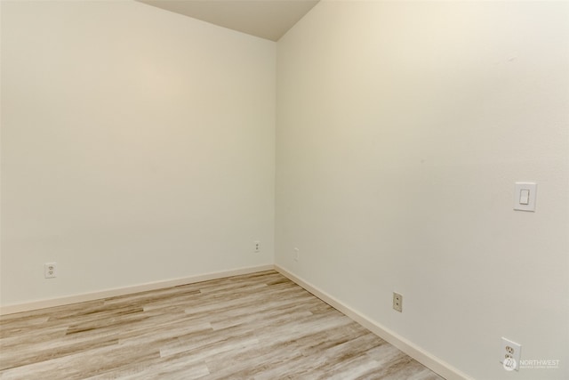 spare room with light hardwood / wood-style flooring
