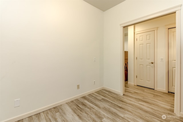 unfurnished room featuring light hardwood / wood-style floors