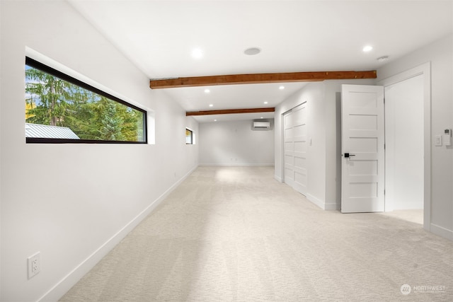 corridor featuring beamed ceiling, a wall unit AC, and light colored carpet