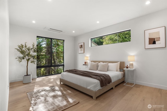 bedroom with light hardwood / wood-style floors