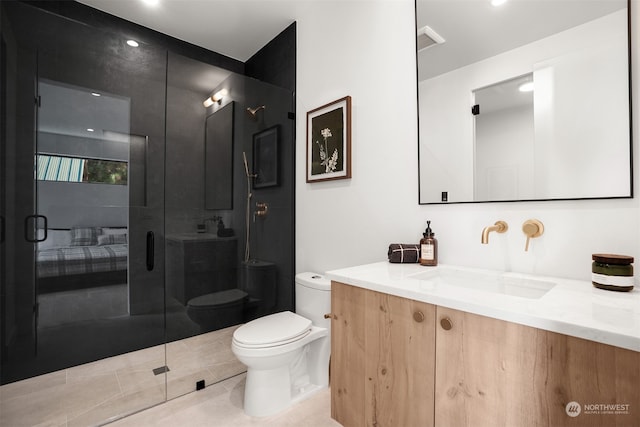 bathroom with vanity, toilet, tile patterned flooring, and an enclosed shower