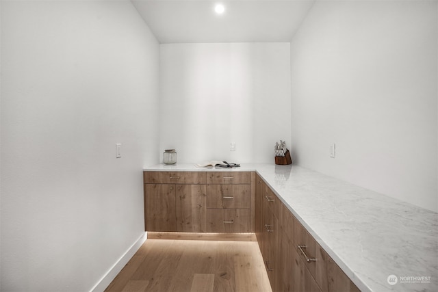 bar with light wood-type flooring