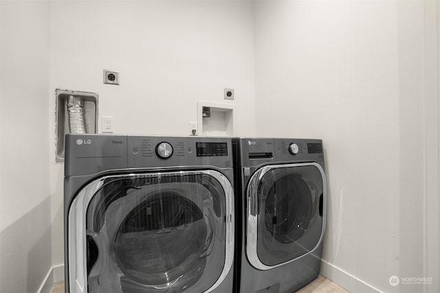 laundry room featuring washer and clothes dryer