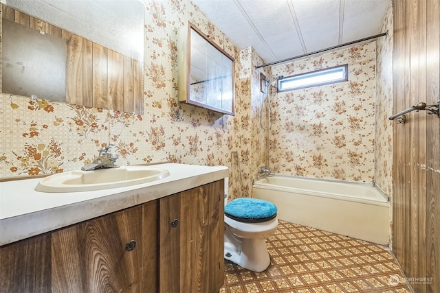 full bathroom with vanity,  shower combination, a textured ceiling, and toilet