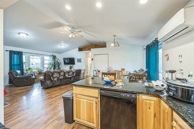 kitchen featuring lofted ceiling, black dishwasher, ceiling fan, light wood-type flooring, and a wall mounted air conditioner