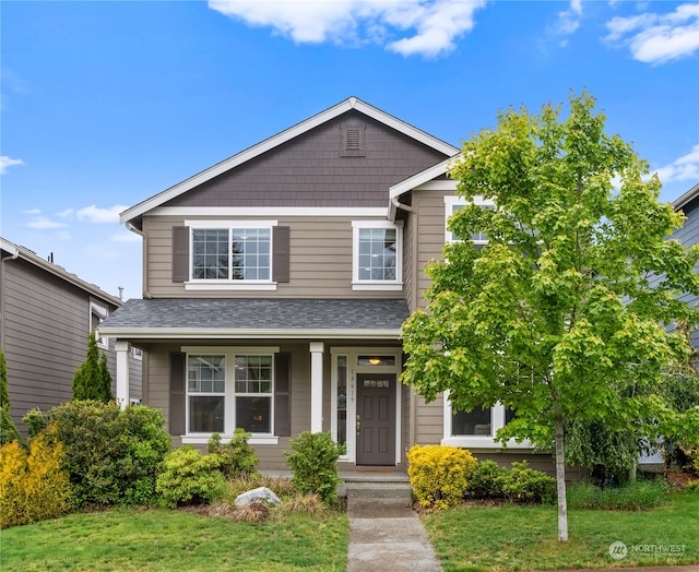 view of front of home featuring a front yard