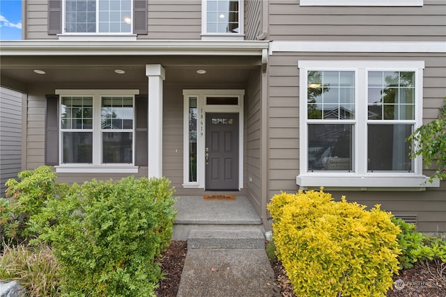 doorway to property with a porch