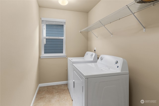 washroom featuring washer and clothes dryer