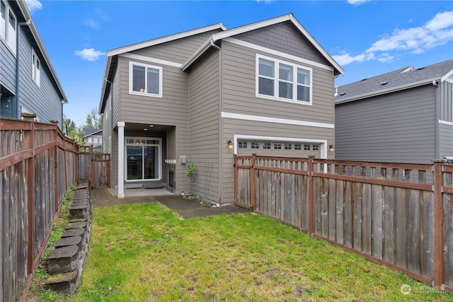 rear view of property with a lawn