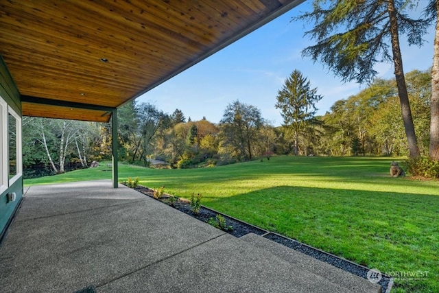 surrounding community with a patio and a lawn