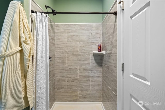 bathroom featuring a shower with curtain